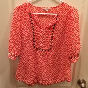 41 Hawthorn orange and white top